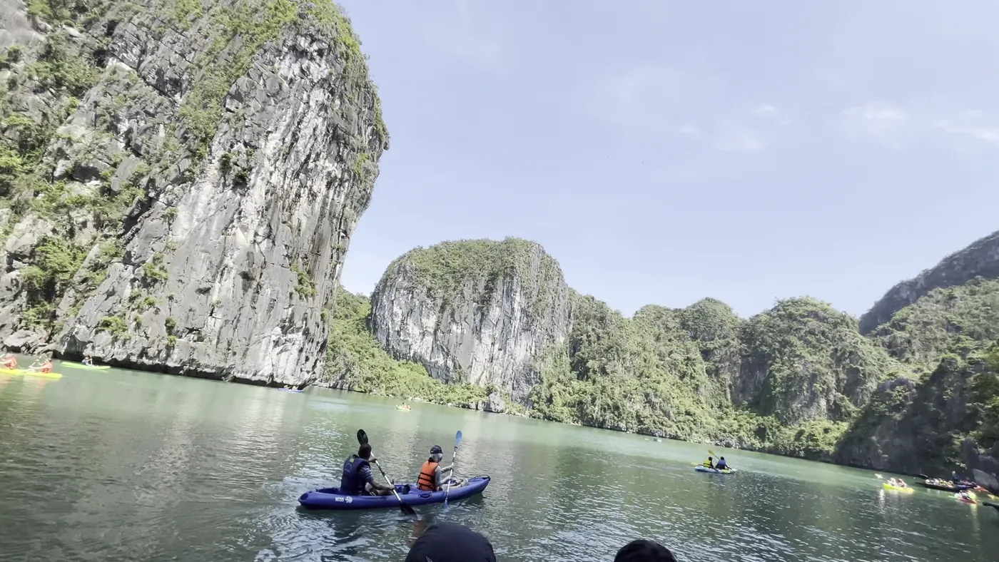 Kayaks between the karsts of Ha Long Bay