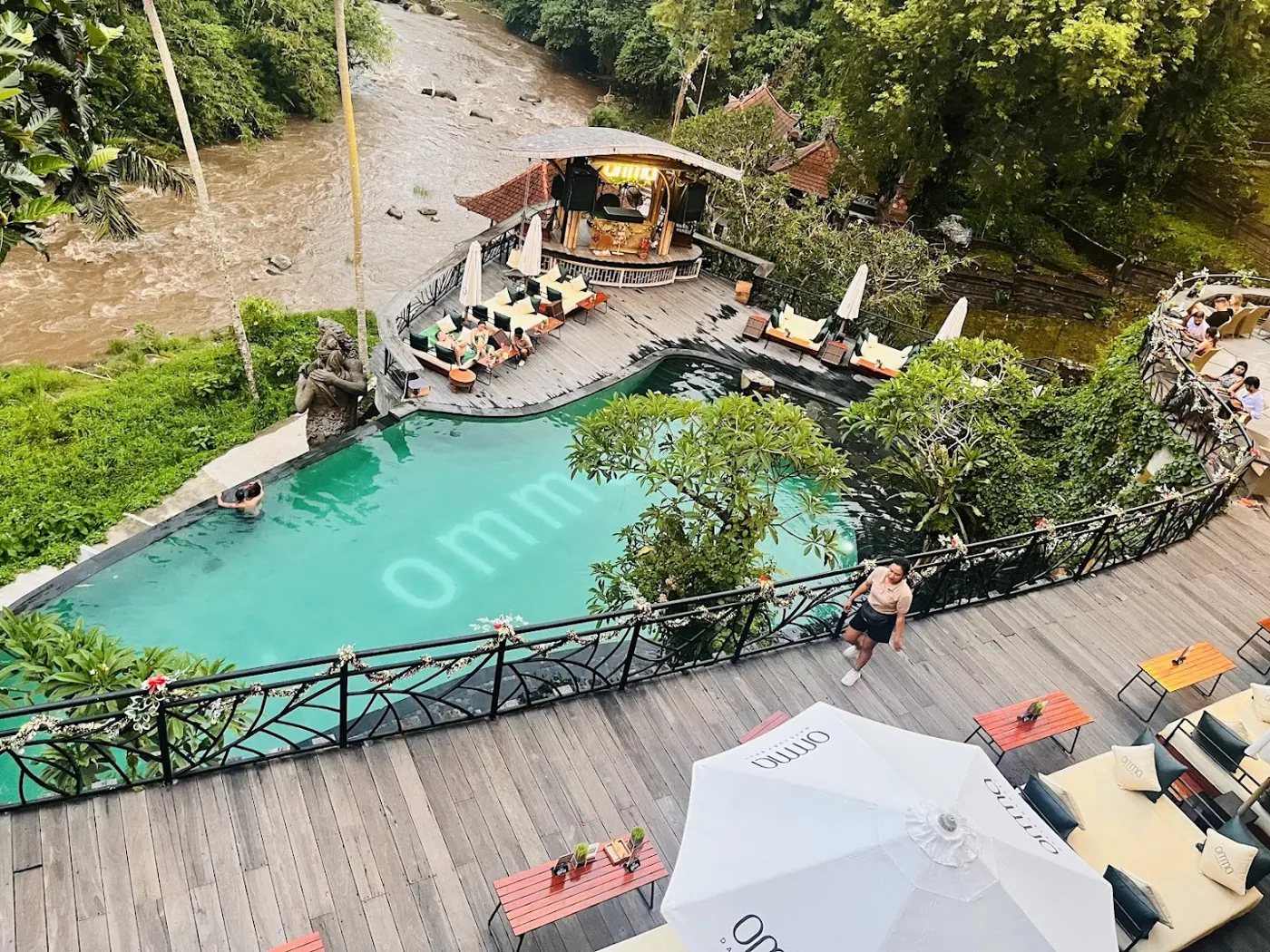 A resort pool among the palms, from above